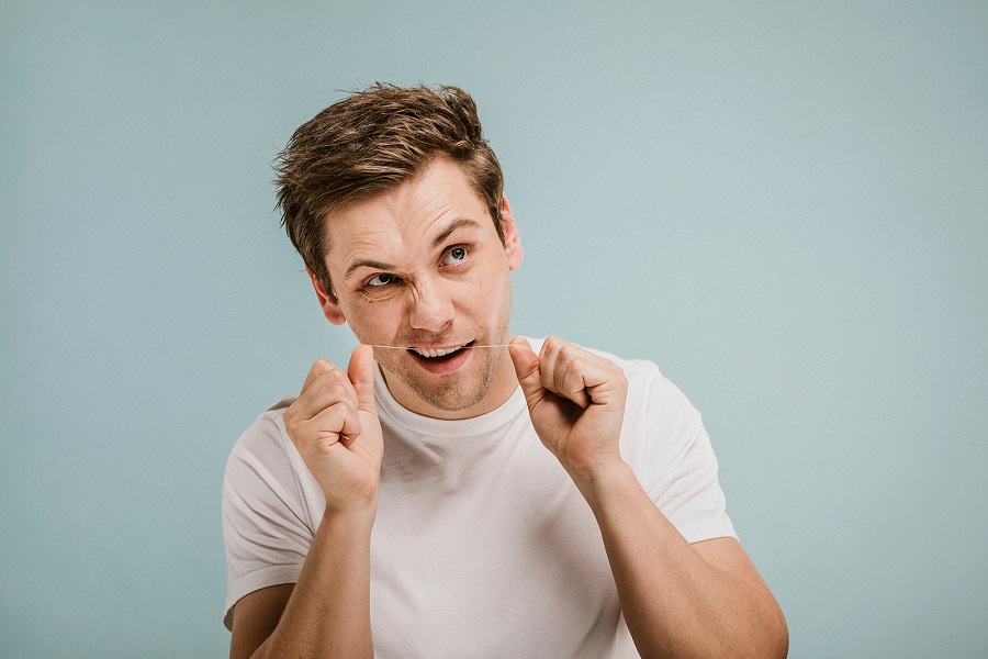 Why is it important to use dental floss?